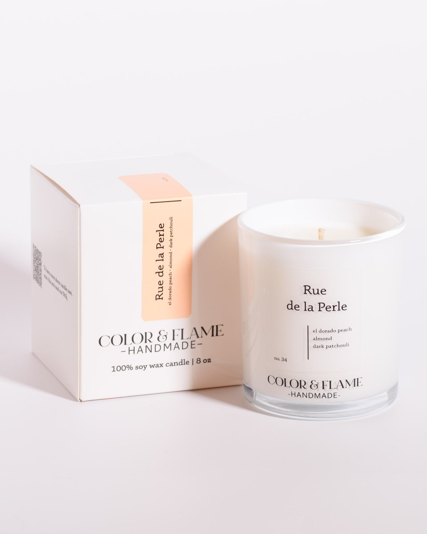 Color & Flame Handmade Rue de la Perle Core Collection candle displayed beside its white box.
