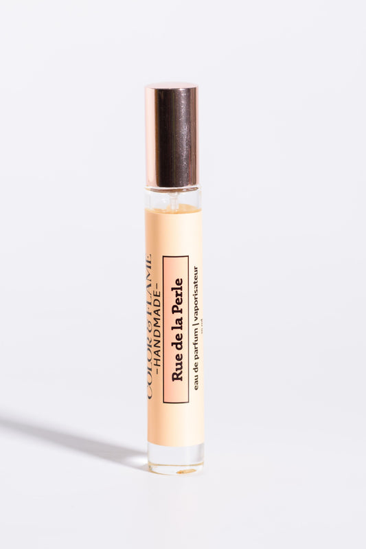 Color & Flame Handmade Rue de la Perle 10 ml perfume spray with its rose-gold cap attached.

