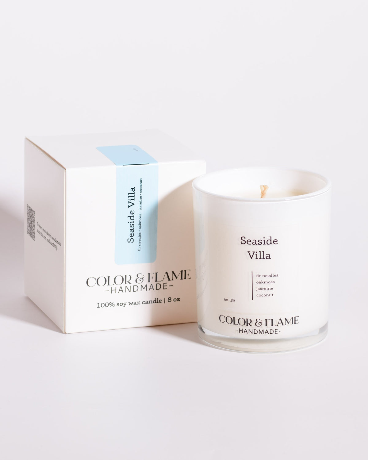 Color & Flame Handmade Seaside Villa Core Collection candle displayed beside its white box.
