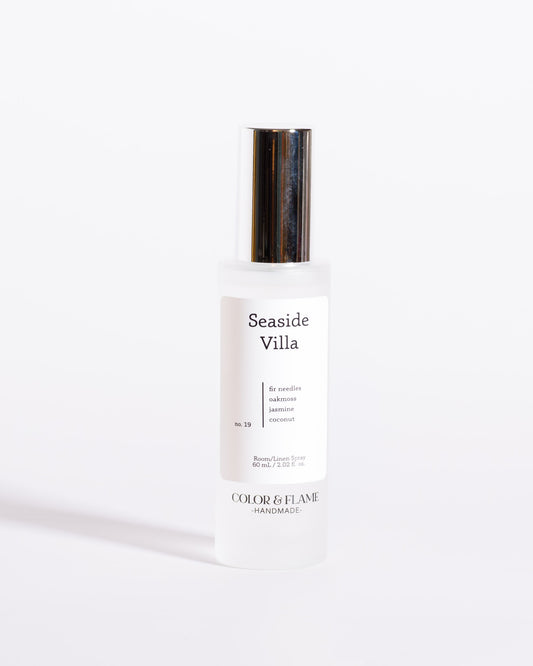 Color & Flame Handmade Seaside Villa room and linen spray bottle with its silver cap attached.
