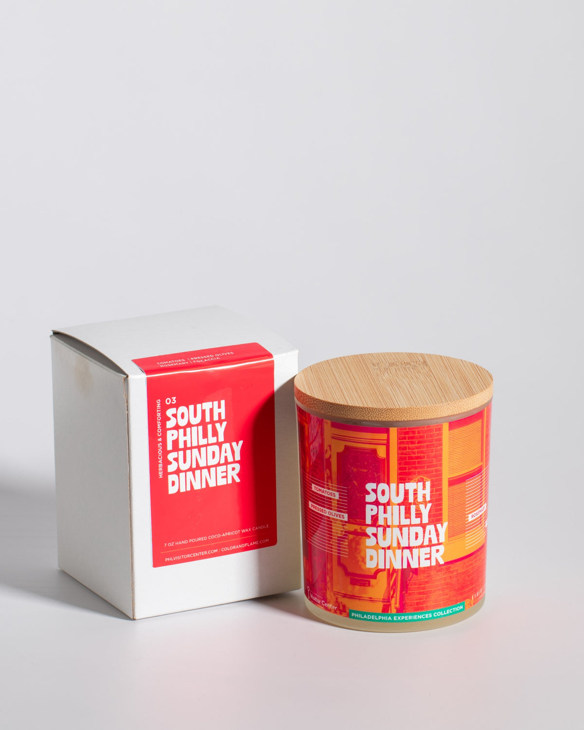 Color & Flame Handmade South Philly Sunday Dinner Philadelphia Experiences candle displayed beside its white box.
