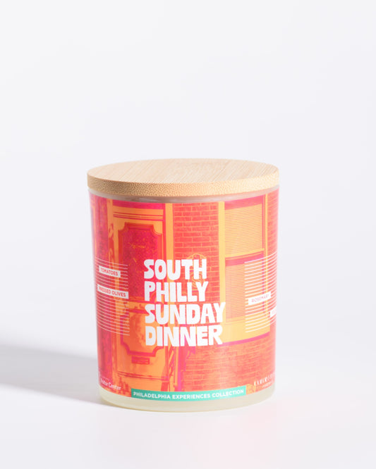 Color & Flame Handmade South Philly Sunday Dinner Philadelphia Experiences candle with its bamboo lid attached.
