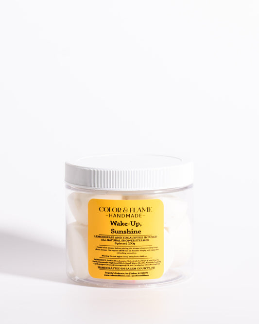 Color & Flame Handmade Wake-Up, Sunshine lemongrass and eucalyptus shower steamers in a clear jar.